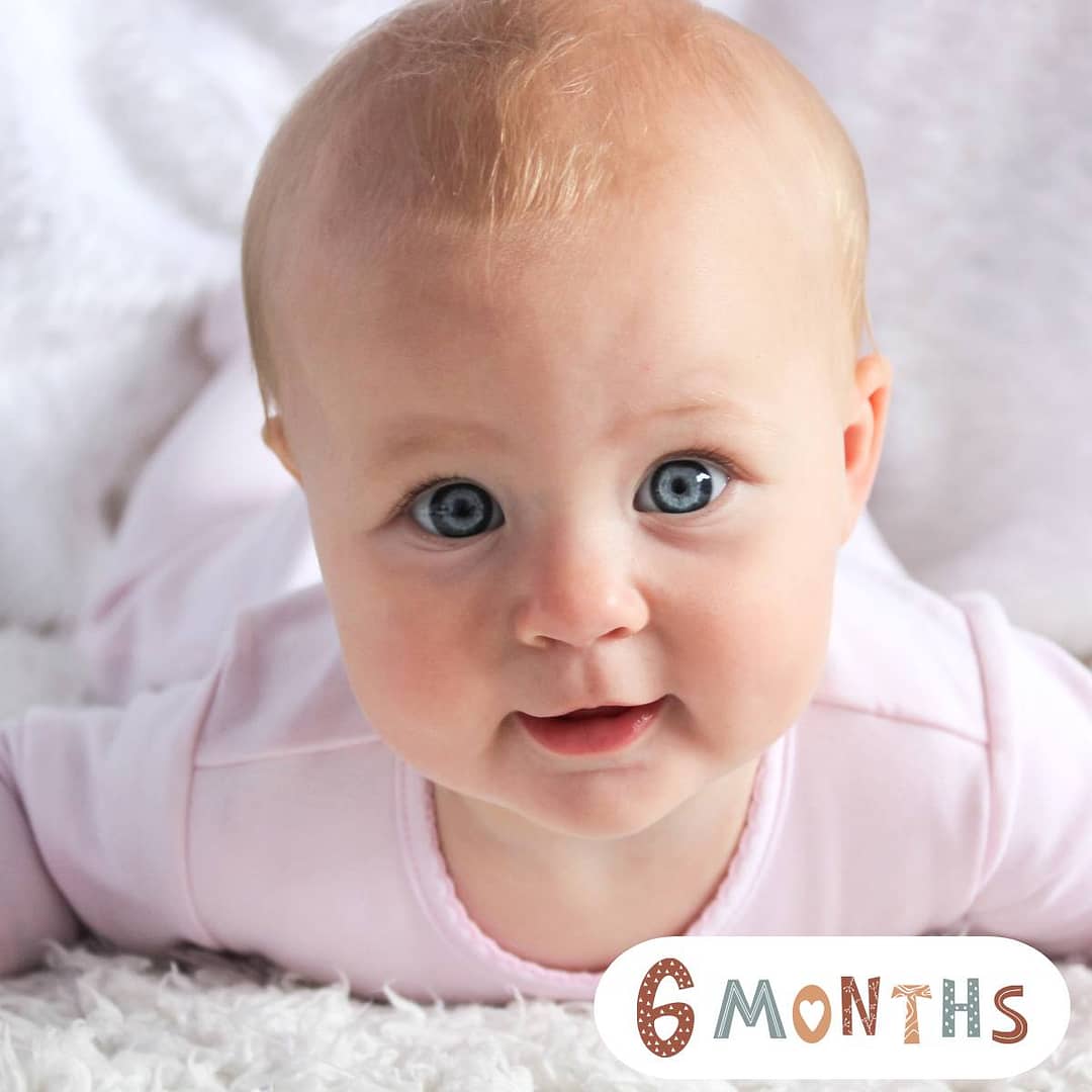 6-month-old baby sitting up and playing – baby milestone by month tips, strength building, and early development activities