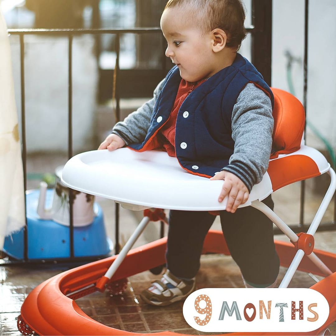 9-month-old baby standing and cruising along furniture – baby milestone by month achievements and early growth and development
