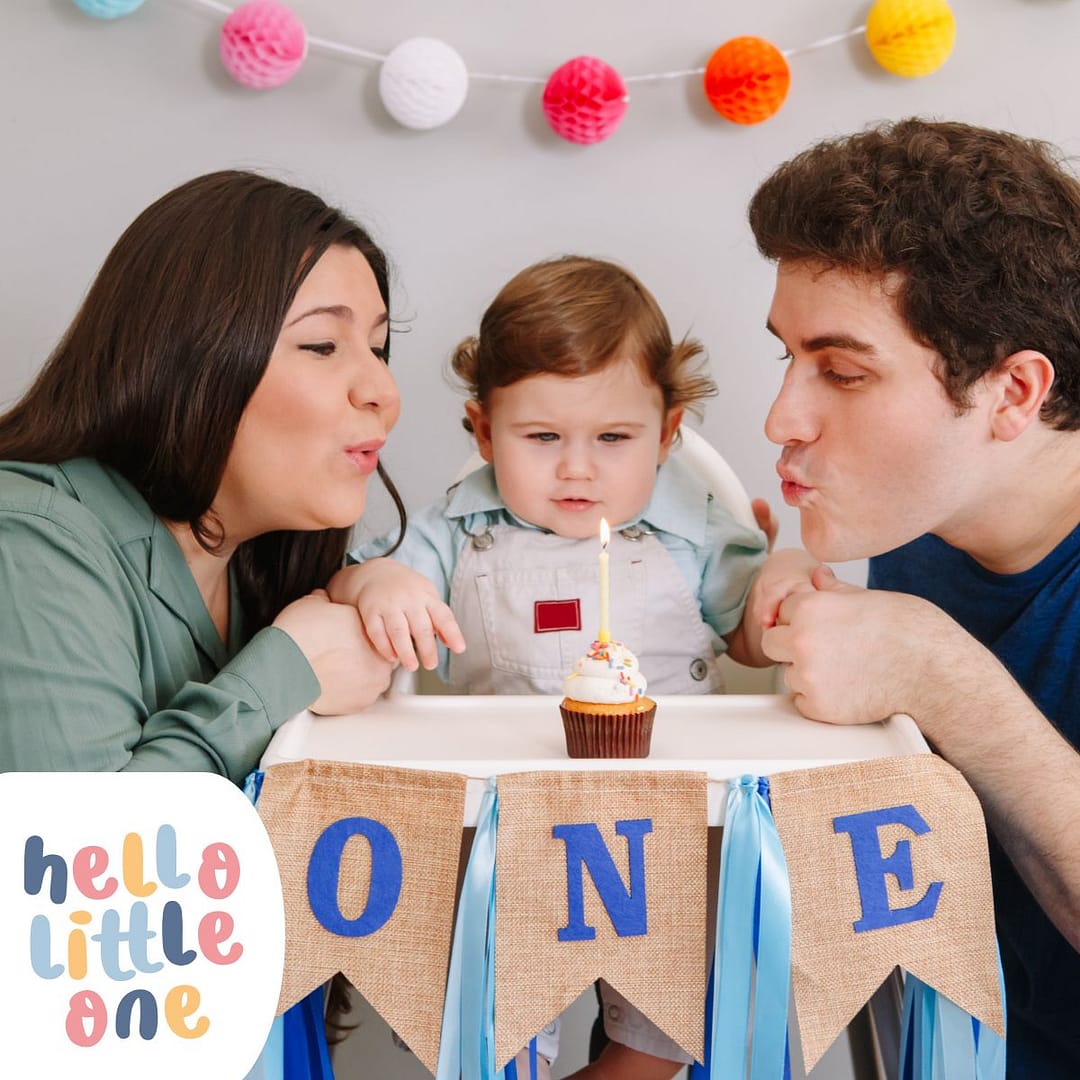 Parent celebrating first birthday with 12-month-old baby – bonding and child development